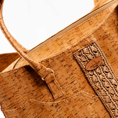 Lilah-Handbag embodies natural elegance with its unique combination of cork and crocheted raffia.